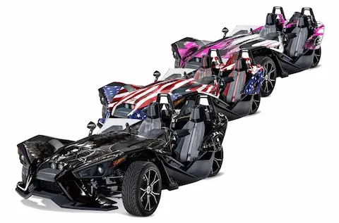 Polaris Slingshot SL roadsters shown in three custom graphic kit looks